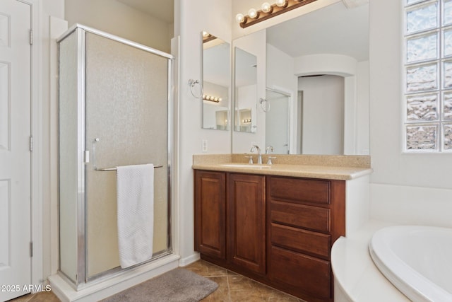 11142 E Ravenna Ave, Mesa, AZ 85212 - bathroom with a stall shower, vanity, a bath, and tile patterned floors