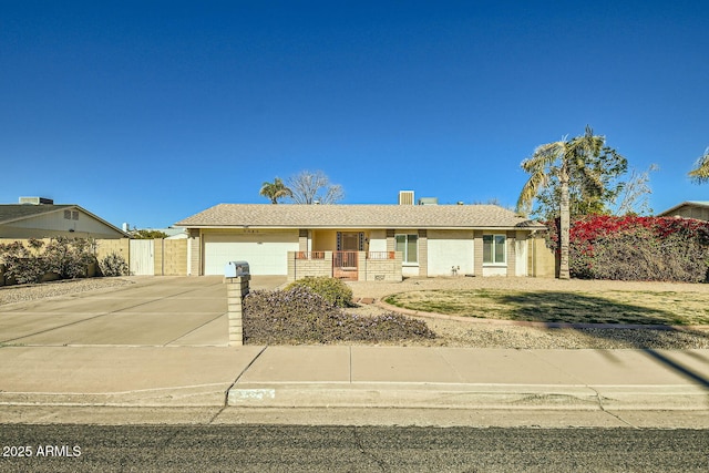 ranch-style house featuring a garage