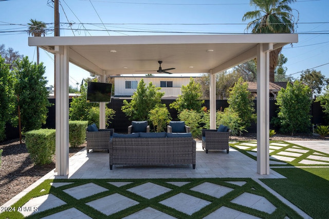 view of patio featuring ceiling fan and an outdoor living space