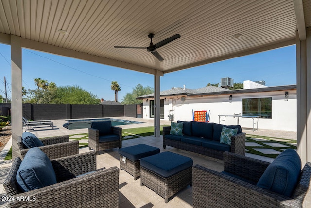 view of patio / terrace featuring a fenced in pool, outdoor lounge area, and ceiling fan