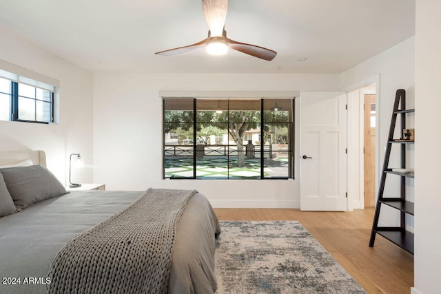 bedroom featuring light hardwood / wood-style floors and ceiling fan