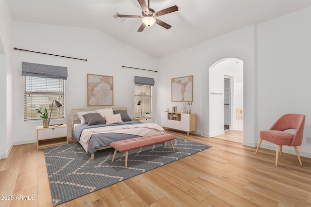 bedroom with ceiling fan, light hardwood / wood-style floors, and lofted ceiling