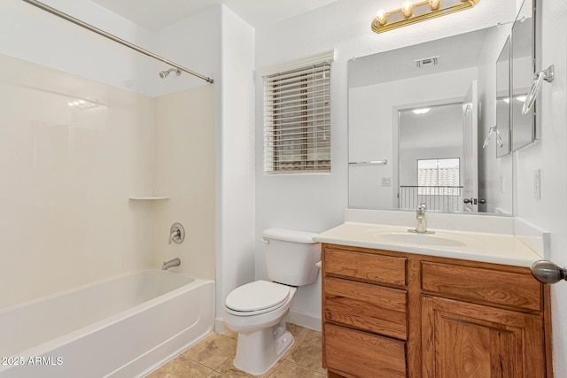 full bathroom featuring tile patterned floors, vanity, toilet, and shower / washtub combination