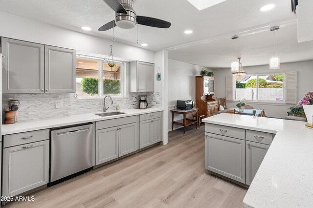 10228 W Concord Ave, Sun City, AZ 85351 - kitchen with dishwasher, a sink, gray cabinetry, tasteful backsplash, and recessed lighting