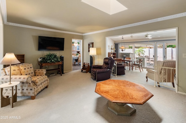10228 W Concord Ave, Sun City, AZ 85351 - living area with carpet floors, ornamental molding, a skylight, and ceiling fan