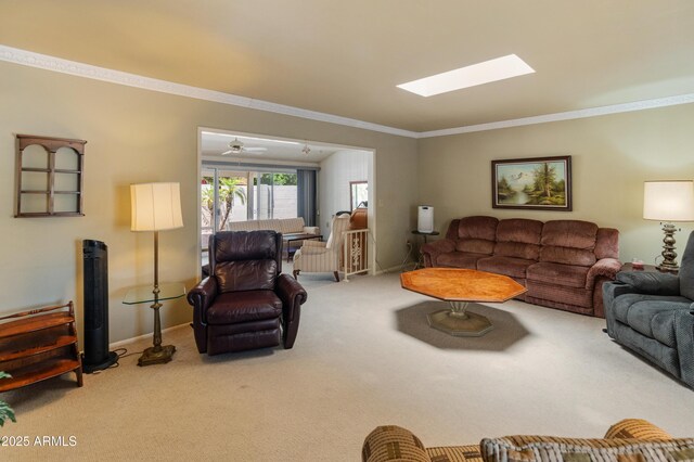 10228 W Concord Ave, Sun City, AZ 85351 - living area with carpet, crown molding, a skylight, and baseboards