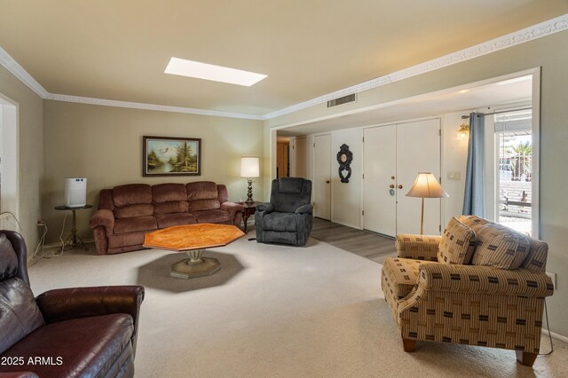 10228 W Concord Ave, Sun City, AZ 85351 - carpeted living room with a skylight and ornamental molding