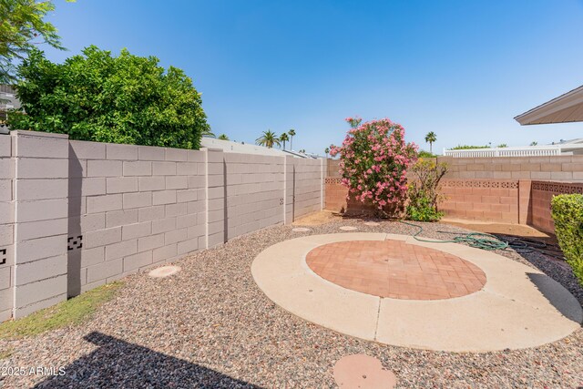 10228 W Concord Ave, Sun City, AZ 85351 - fenced backyard with a patio area