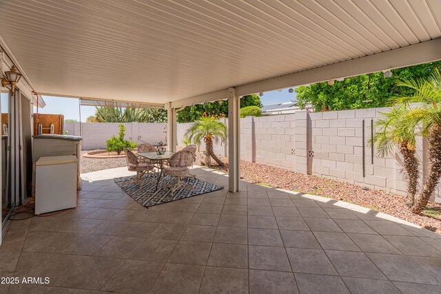 10228 W Concord Ave, Sun City, AZ 85351 - view of patio featuring outdoor dining space and a fenced backyard