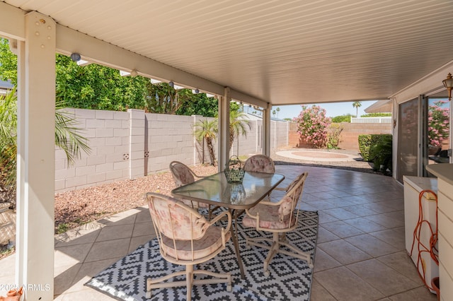 10228 W Concord Ave, Sun City, AZ 85351 - view of patio / terrace with a fenced backyard and outdoor dining area