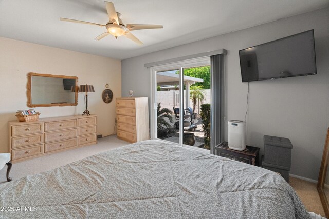 10228 W Concord Ave, Sun City, AZ 85351 - carpeted bedroom featuring access to exterior and a ceiling fan