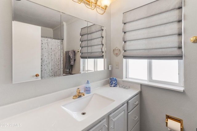 10228 W Concord Ave, Sun City, AZ 85351 - bathroom with vanity and a chandelier