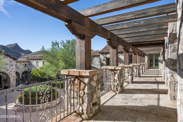 view of patio / terrace featuring a mountain view and a pergola