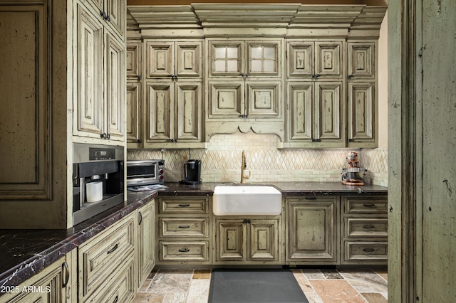 kitchen featuring tasteful backsplash and sink