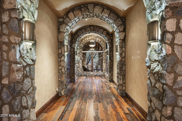 hallway with dark hardwood / wood-style floors