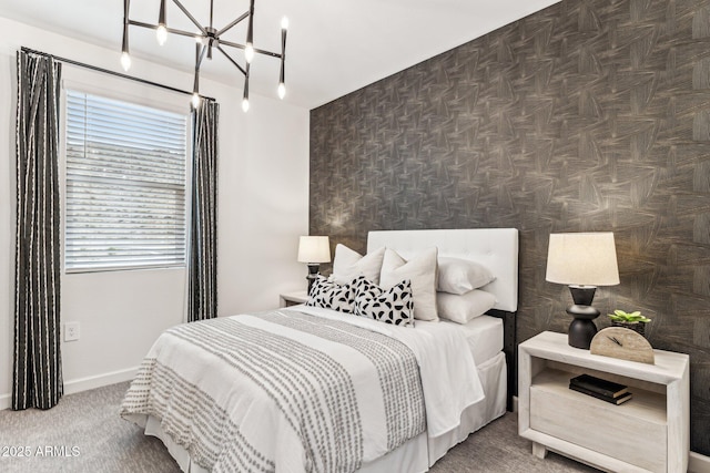 carpeted bedroom with an inviting chandelier