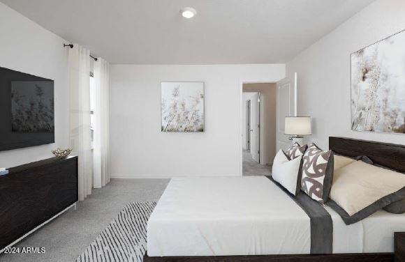 bedroom featuring light colored carpet