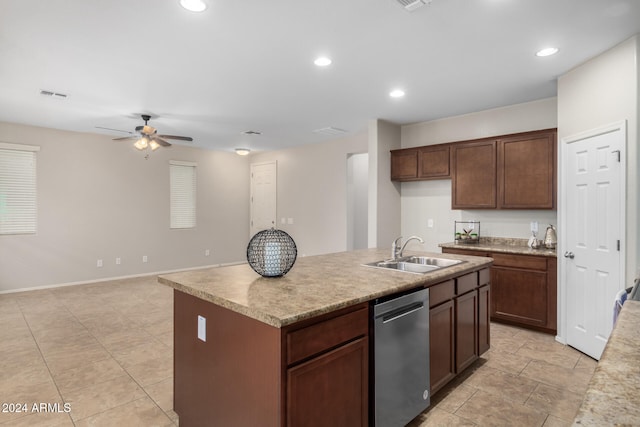 kitchen featuring dishwasher, sink, ceiling fan, an island with sink, and dark brown cabinets