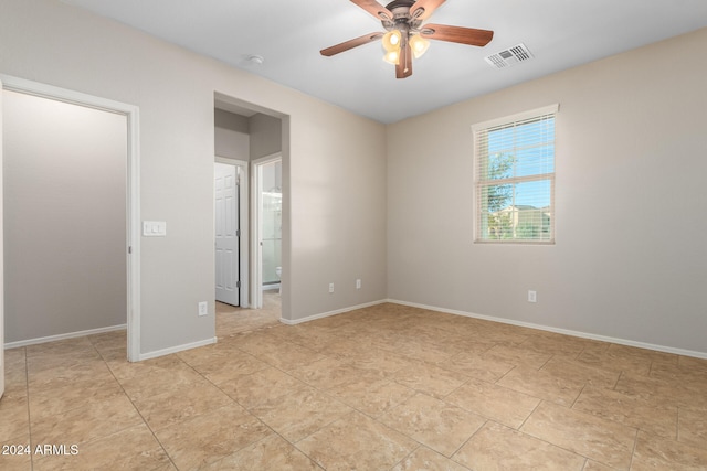 spare room with ceiling fan