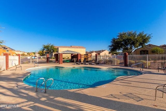 view of swimming pool featuring a patio area