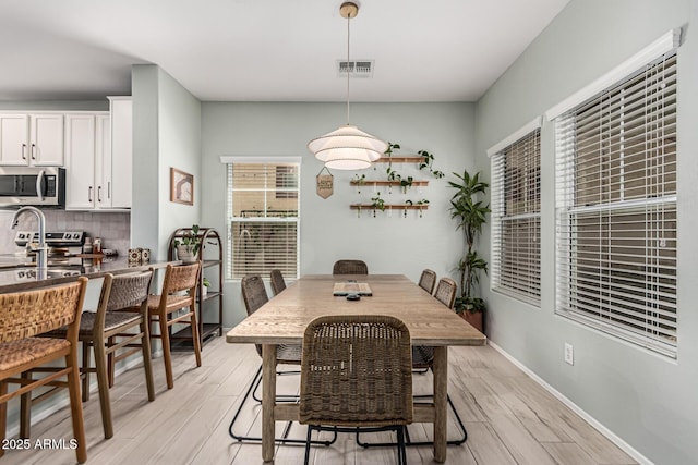 3037 E Hobart St, Gilbert, AZ 85296 - dining room featuring light wood-type flooring