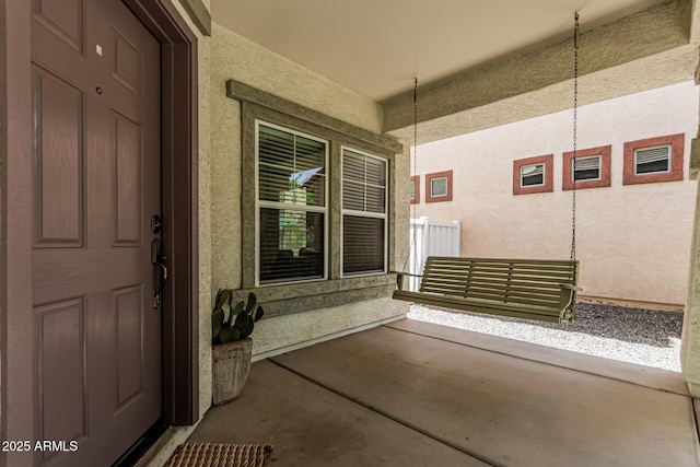 3037 E Hobart St, Gilbert, AZ 85296 - view of exterior entry featuring stucco siding and a porch