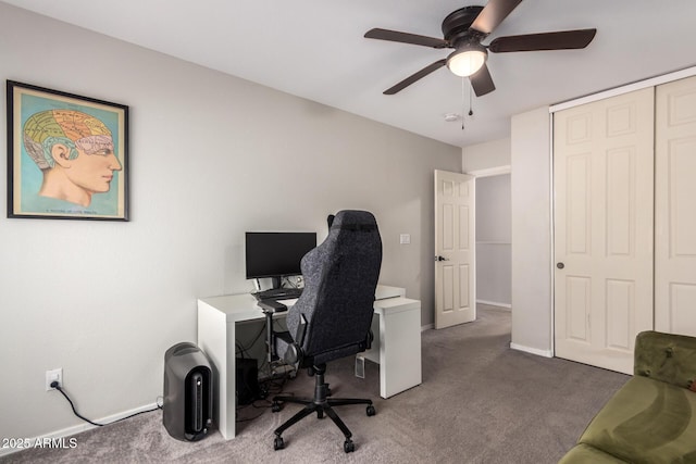 office featuring ceiling fan and dark colored carpet