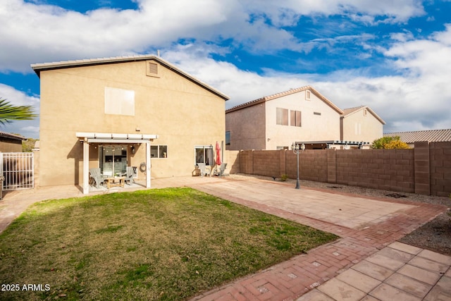 rear view of property featuring a patio area, a lawn, and a pergola