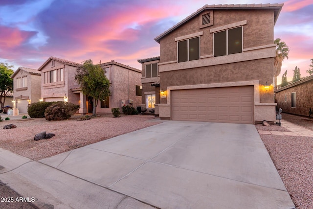 front of property with a garage