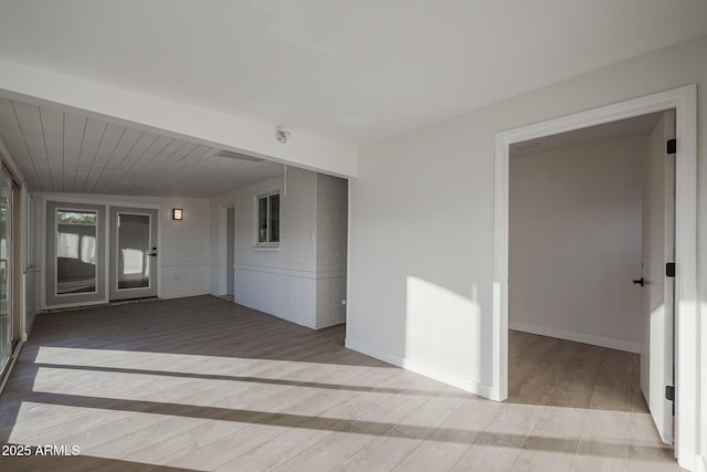 unfurnished room featuring hardwood / wood-style floors