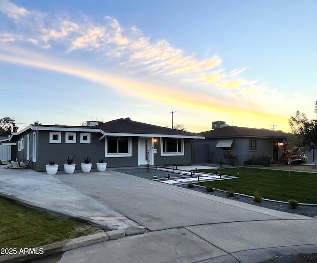 ranch-style house with a yard