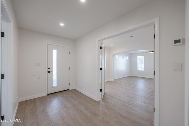 entryway featuring ceiling fan and light hardwood / wood-style flooring