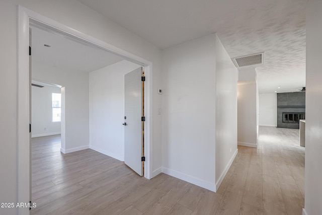 corridor featuring light wood-type flooring