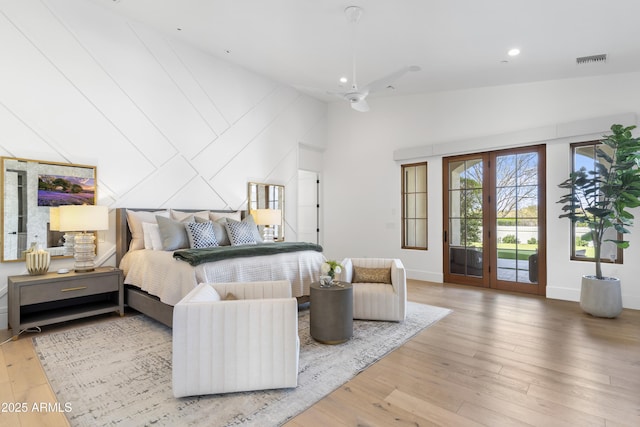 bedroom featuring french doors, recessed lighting, visible vents, light wood-style flooring, and access to outside