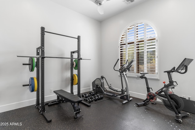 workout room featuring visible vents and baseboards