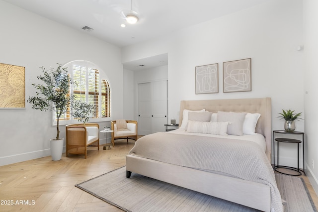 bedroom with visible vents and baseboards