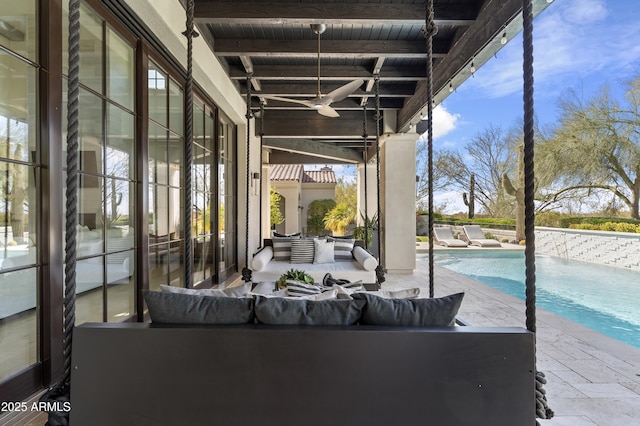 view of patio with an outdoor pool, an outdoor hangout area, and a ceiling fan