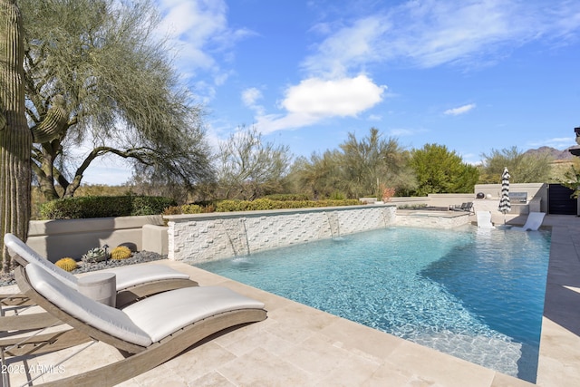 outdoor pool featuring an in ground hot tub