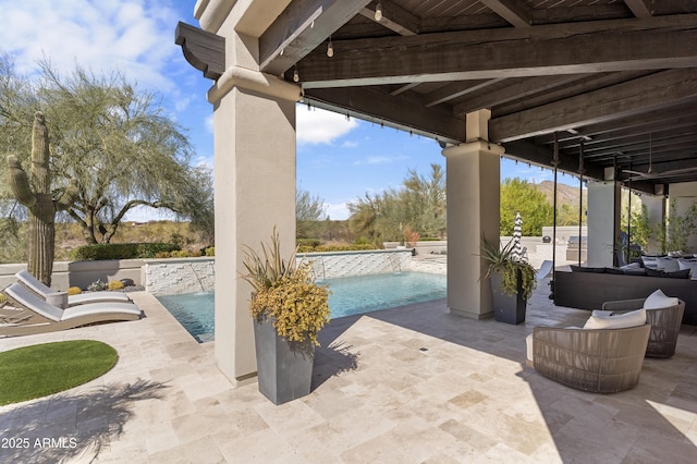 view of patio featuring outdoor lounge area and an outdoor pool