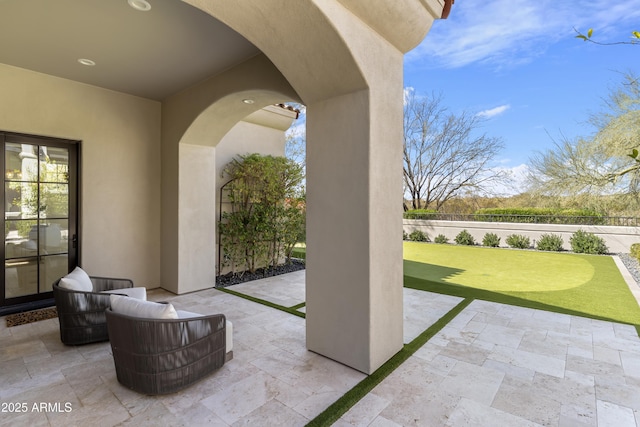 view of patio featuring fence