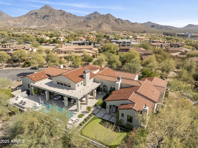 drone / aerial view with a residential view and a mountain view