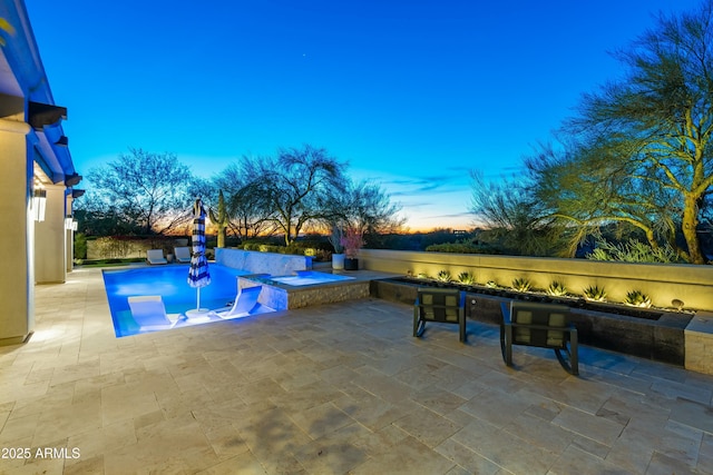 view of pool with a patio, a fenced in pool, and an in ground hot tub