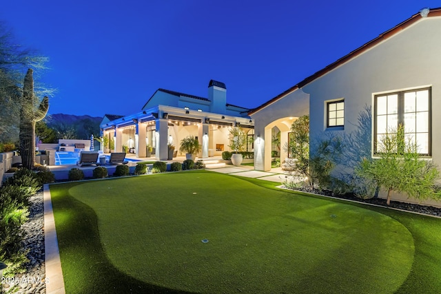 view of yard with a patio and a jacuzzi