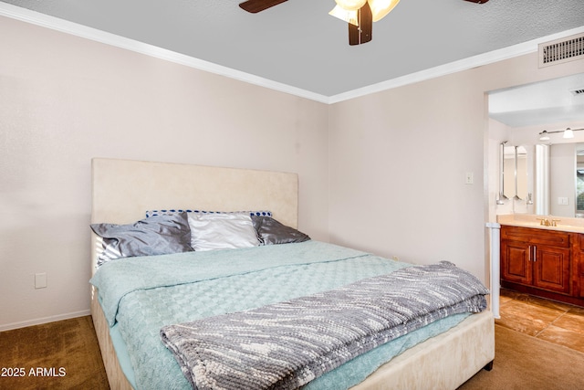 carpeted bedroom featuring connected bathroom, crown molding, sink, and ceiling fan