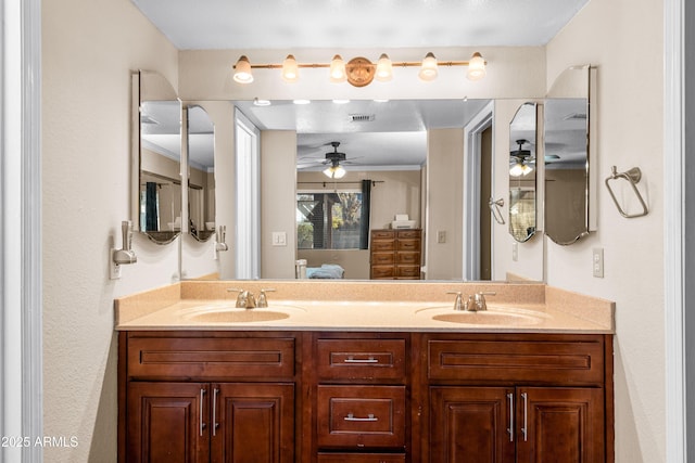 bathroom featuring vanity and ceiling fan