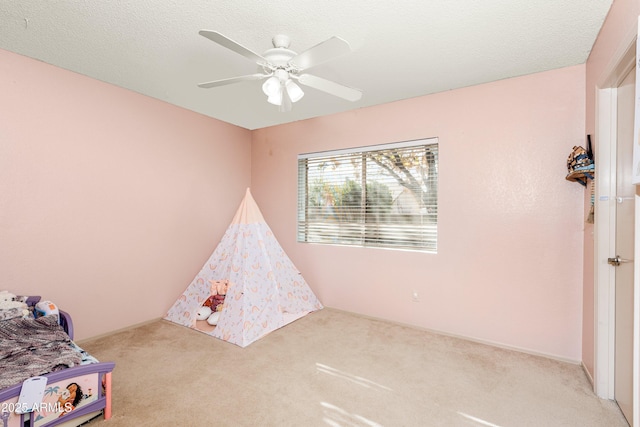 bedroom with ceiling fan and light colored carpet