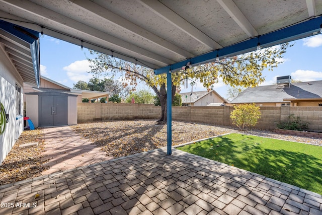 view of patio with a storage shed