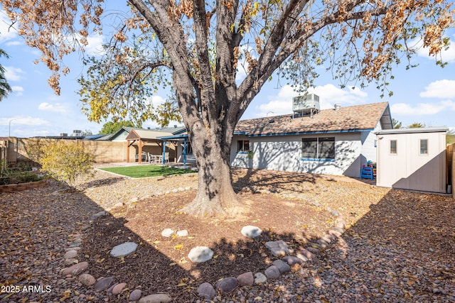 back of property featuring a storage unit, a patio area, and central air condition unit