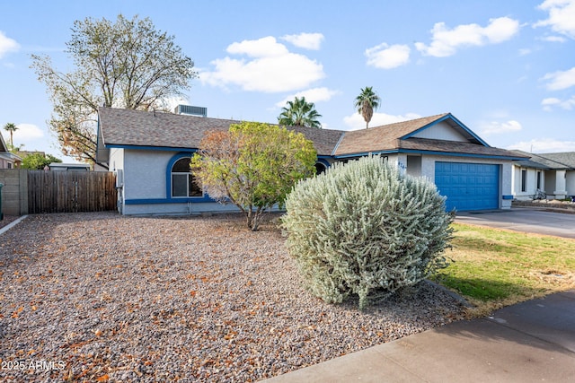 ranch-style house featuring a garage