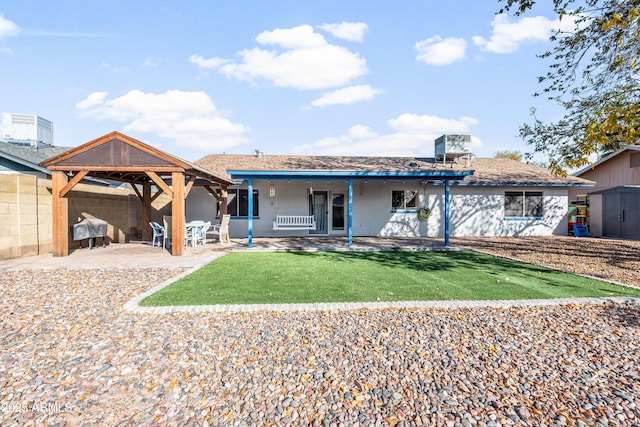 back of house featuring a patio area